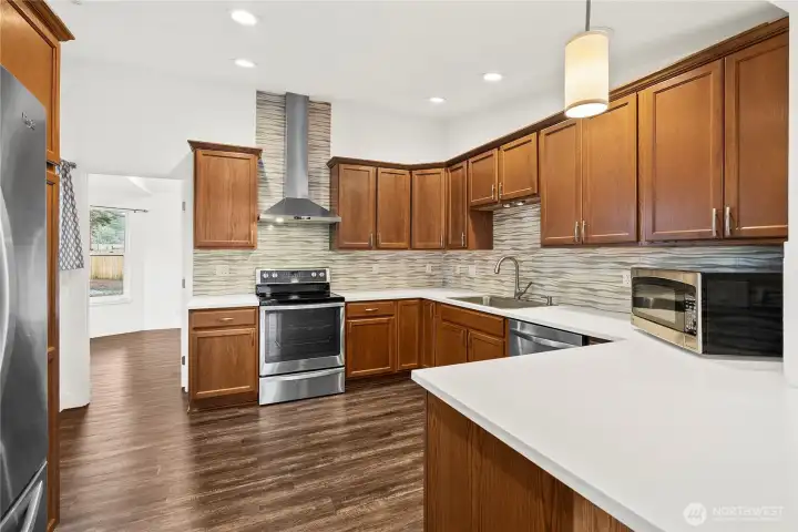 Remodeled kitchen with quartz countertops.