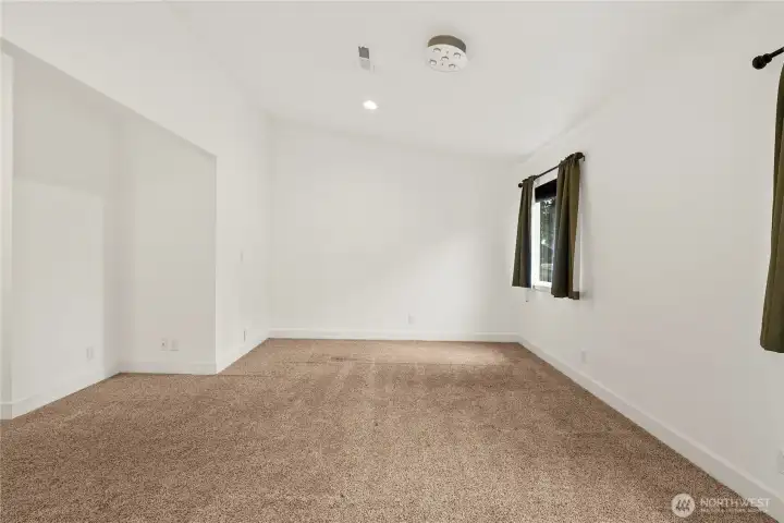 Primary bedroom with vaulted ceilings