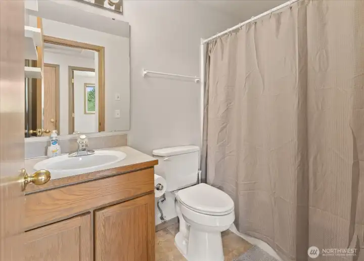 Hall bathroom with clean, simple finishes