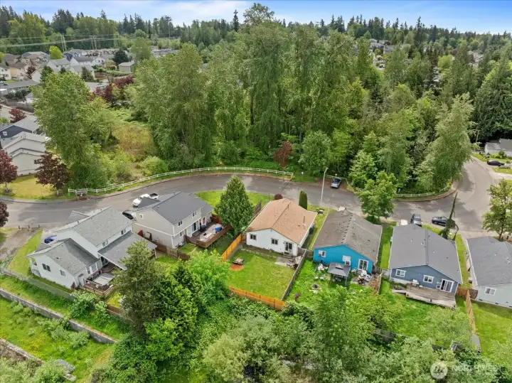 Elevated aerial perspective capturing the full property and surrounding neighborhood setting