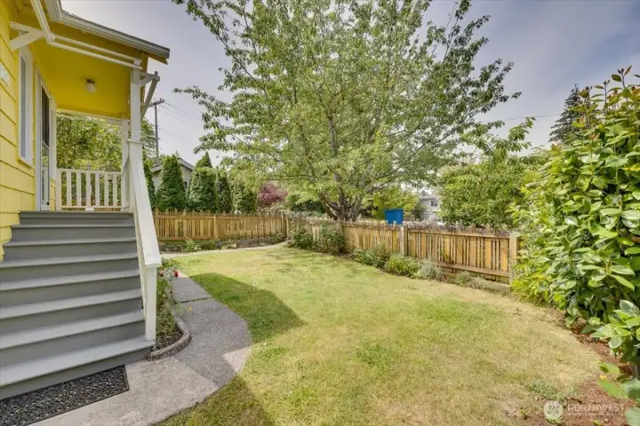 A charming covered front porch welcomes you inside.
