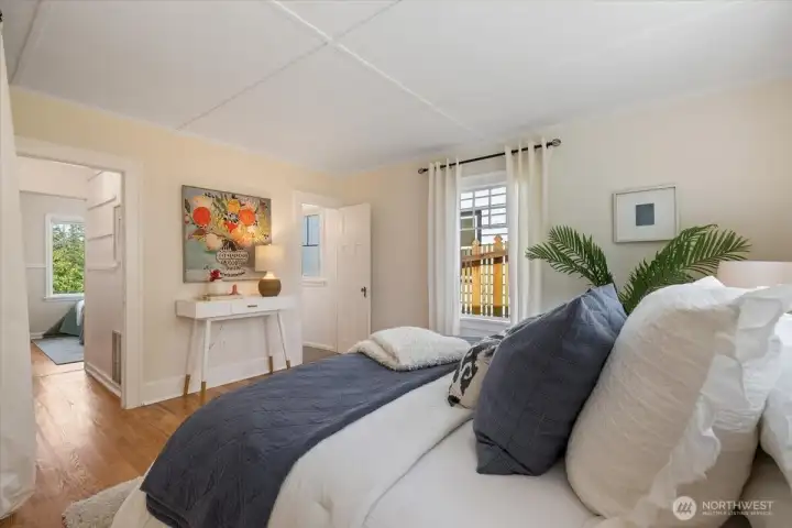 pass through closet to the second bedroom on the left and access to the bathroom on the right.