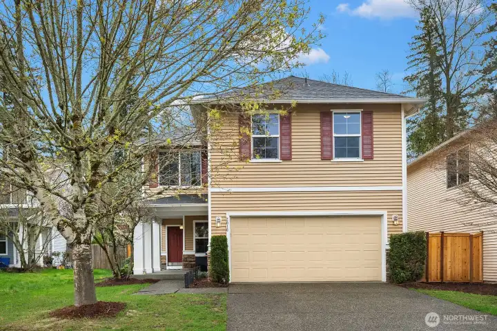 Charming curb appeal with a classic two-story facade, attached two-car garage, and mature landscaping — a warm and welcoming first impression in the sought-after Norris Estates community.