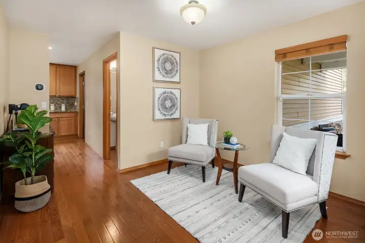 This versatile main level flex space offers endless possibilities, featuring rich hardwood floors, fresh designer paint, and elegant built-in shelving that adds both function and character to the room. Whether used as a home office, reading nook, or formal sitting room, this thoughtfully designed space adds an extra layer of livability and flexibility to the main level.