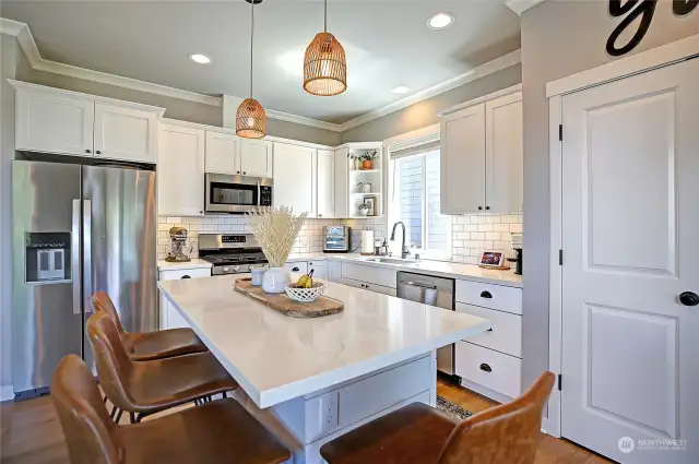 Gorgeous kitchen with smart lighting, below/above cabinet lighting, custom pullouts & SS appliances.