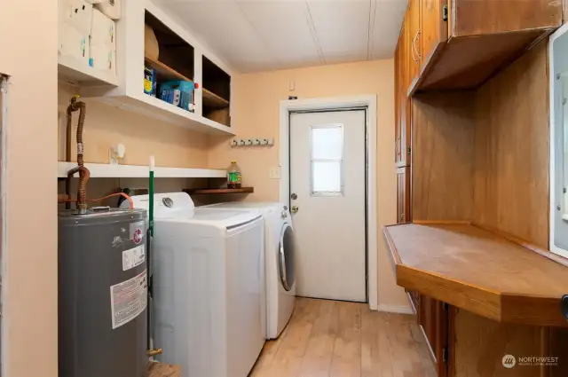 Handy utility room with included washer and dryer