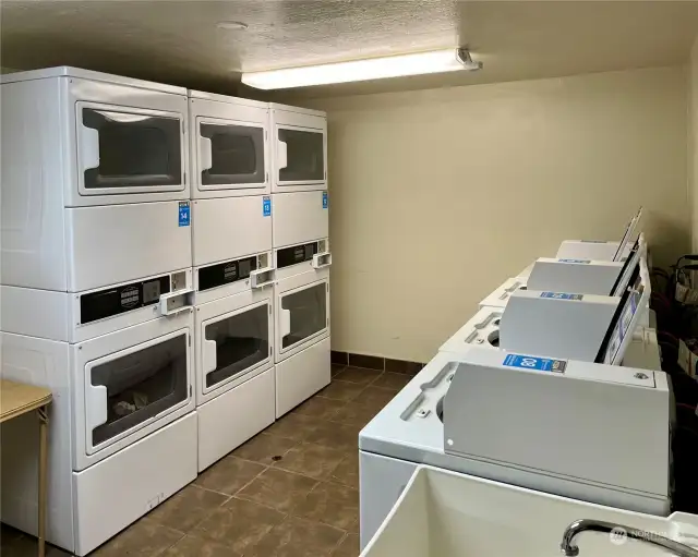 Spacious laundry room is just across the way from your unit.