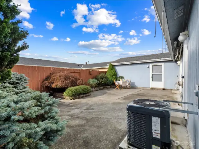 The back yard is landscaped and have room to entertain on those warm summer days. Easy to maintain but give you  he opportunity to add flower pots with color if you are itching to do some gardening.