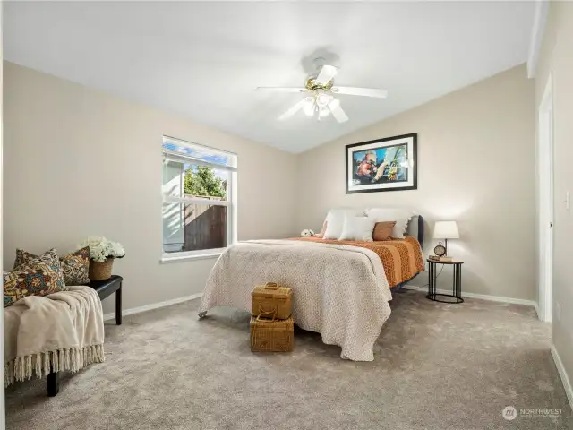 The spacious primary bedroom with en suite have room for a sitting area and easily holds a king size bed. The new paint and carpet gives this room a tranquil feel where you can retreat at the end of the day.