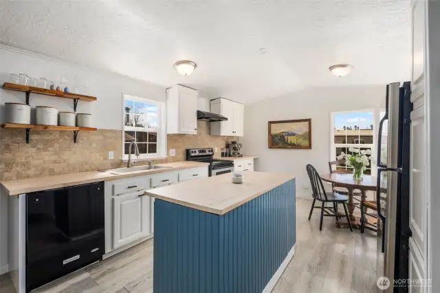 Kitchen has been extended and improved, so functional! Eat-in kitchen area is so convenient.