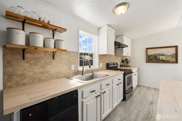 Newer dishwasher, countertops, shelving