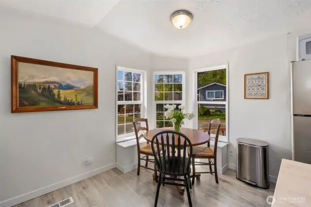 Eat-in kitchen, with built in storage bench that doubles as seating!