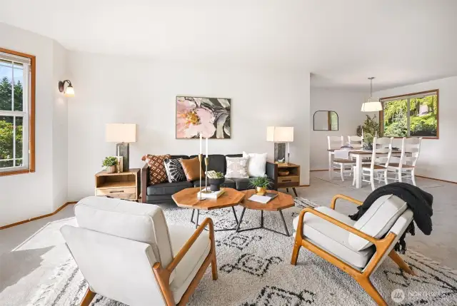 The formal living & dining rooms offer elegant spaces ideal for hosting dinner parties or holiday gatherings.
