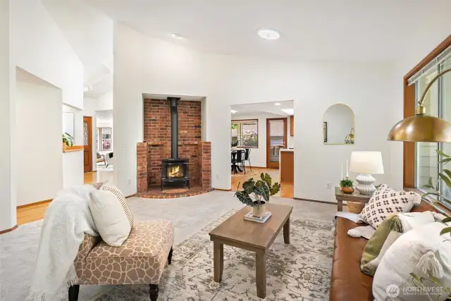 The inviting secondary living room, complete with a warm fireplace, offers a cozy retreat for quiet evenings in.