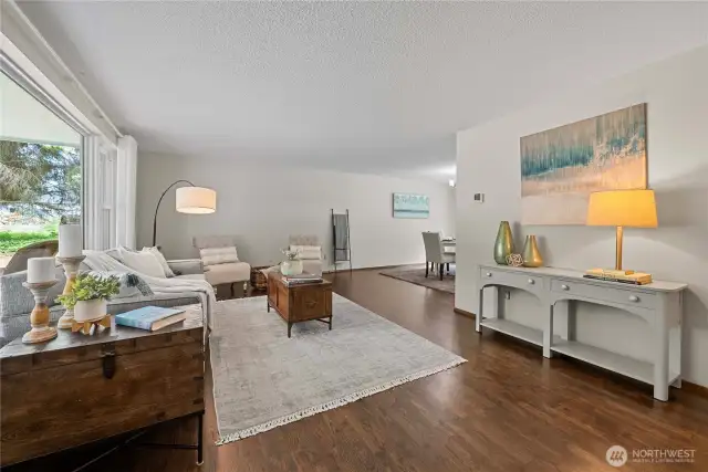 Restored hardwood floors welcome you to the main floor living and dining room.