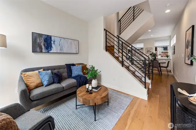 Love how the living is open to the kitchen and dining, yet the spaces lay out in a really livable way.