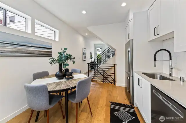 Love how the living is open to the kitchen and dining, yet the spaces lay out in a really livable way. Plus great windows.