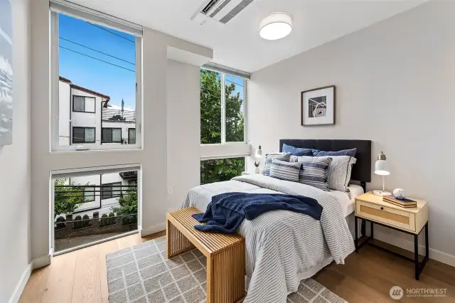 Primary bedroom; A/C, big windows, nice space.