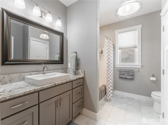 Full Main Bathroom – Modern finishes and clean, bright space.