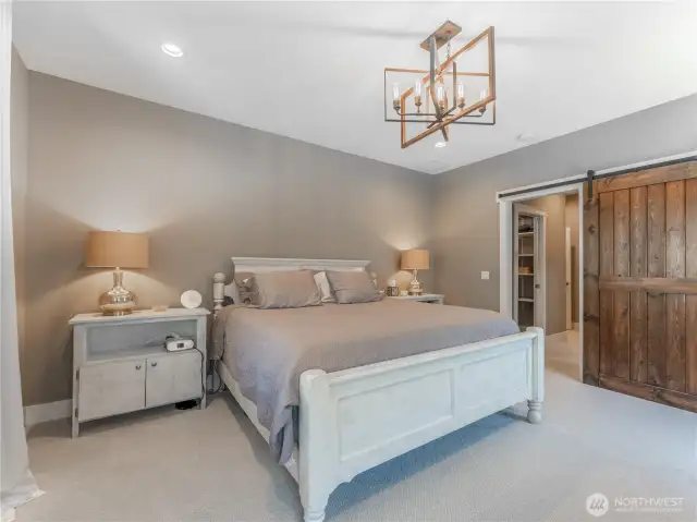 Primary Bedroom Retreat – Peaceful and private with natural light and views.