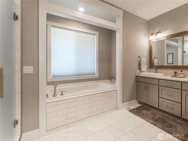 Luxurious Primary Bath – Double vanities, soaking tub, and spacious walk-in shower.