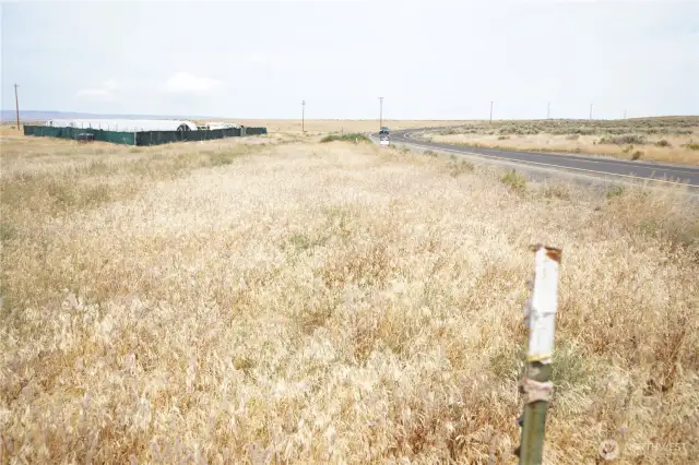 Front property line. / View of neighboring property on the right. / Road to town, the Gorge Amphitheater, and i90