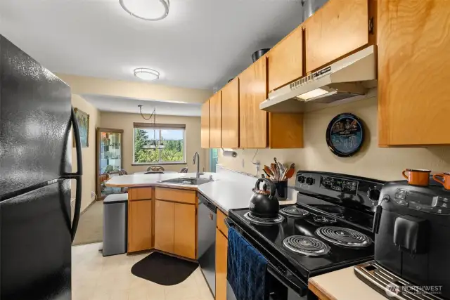 Well designed kitchen with a newer stove