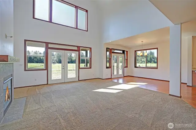 upon entering home you are greeted with a large living area w/ 22 foot ceilings