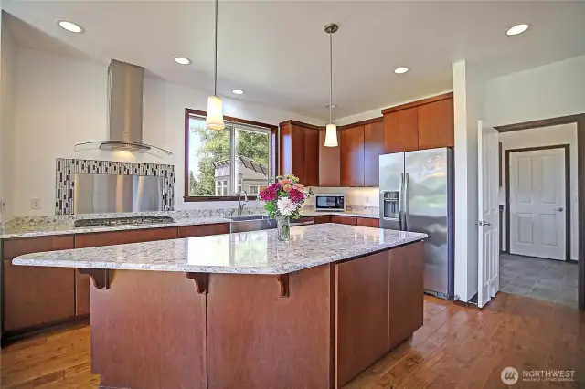 beautiful kitchen with eating space, quartz countertops, stainless steel appliances and farm sink