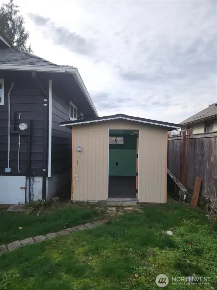 Shed off to the home, sheetrocked and electricity