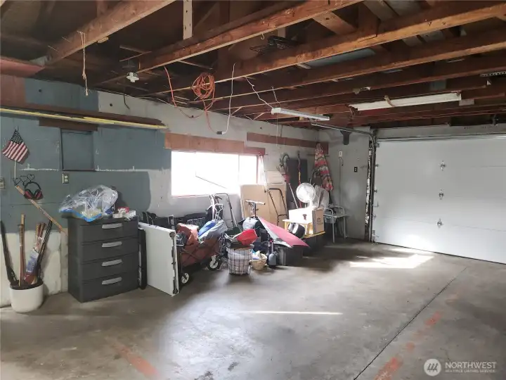 Plenty of light coming in through the windows to the garage, but it also has light above.