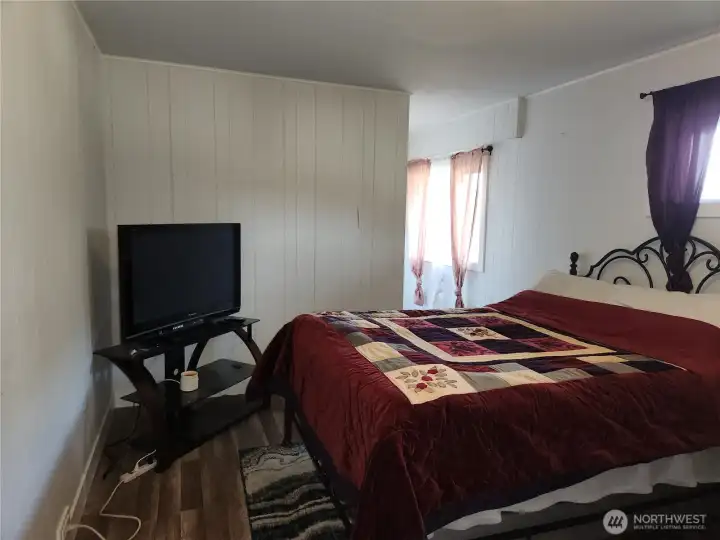 Larger of the two bedrooms downstairs.