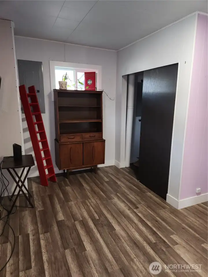 Another view of second bedroom with closet space in view.