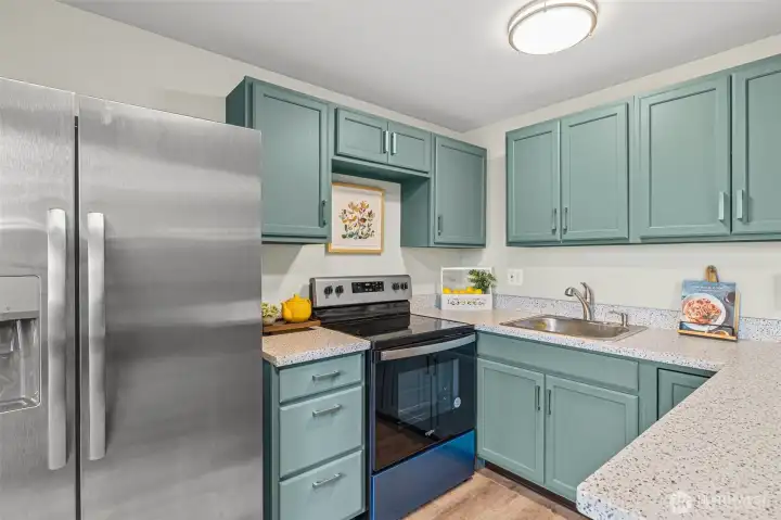 Kitchen with brand new stainless steel appliances and quartz countertops!