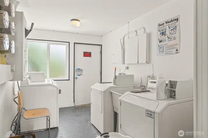 Laundry room conveniently located on building over.