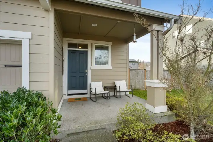 Welcoming front porch sets the tone for this beautifully maintained five-bedroom home with timeless curb appeal.