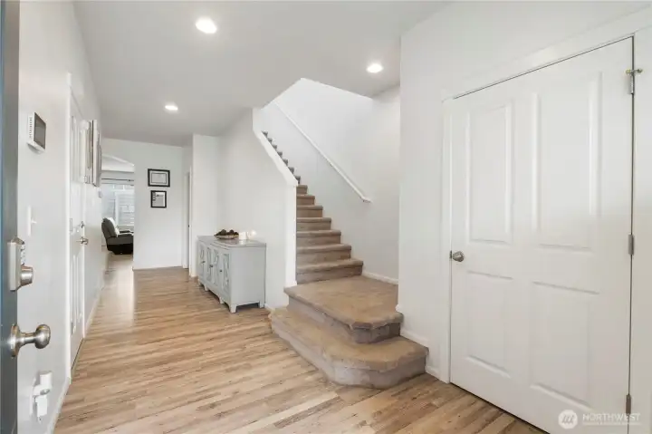 Step inside to a bright and inviting entryway that immediately feels warm, open, and thoughtfully designed.