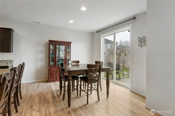 Dining area opens seamlessly from the kitchen, ideal for both intimate meals and larger gatherings.