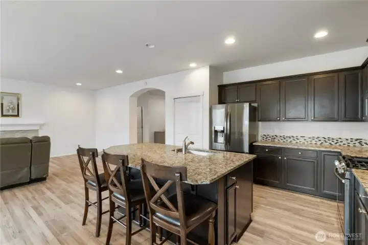Well-appointed kitchen offers ample counter space, generous cabinetry, and room to entertain with ease.