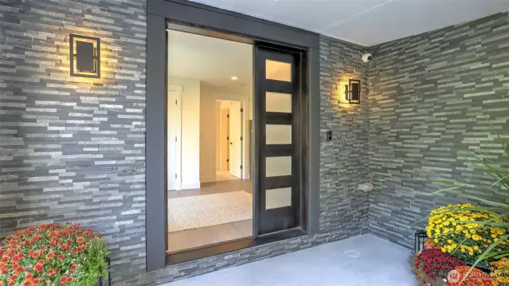 Welcoming and modern stone entry with clean architectural lines.