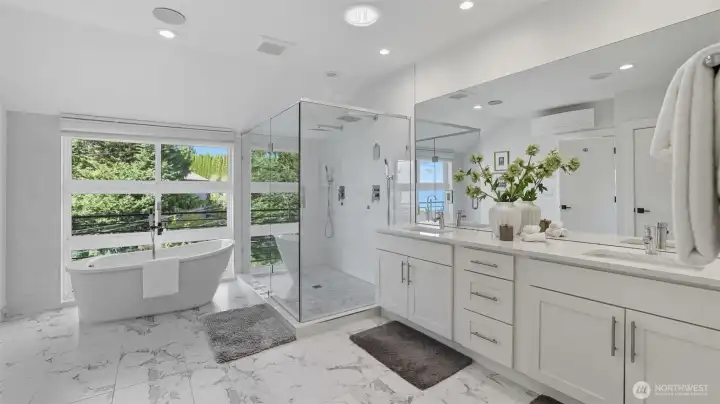 Spa-inspired primary bath with deep soaking tub.