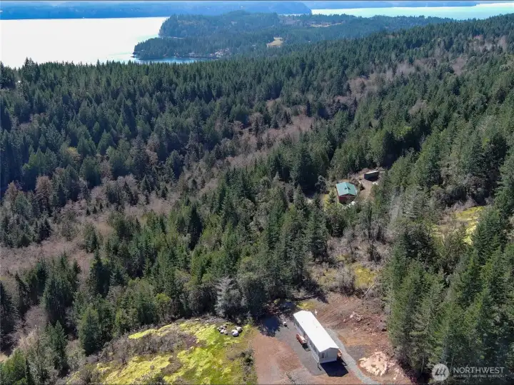 The property is located between the 2 homes and a short distance to Pleasant Harbor below. A public boat launch is located there for easy Hood Canal water access.
