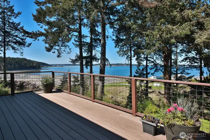 Sweeping views of Penn Cove & Saratoga Passage from the expansive Trex deck and from almost every room in the house, including the lower level workshop.