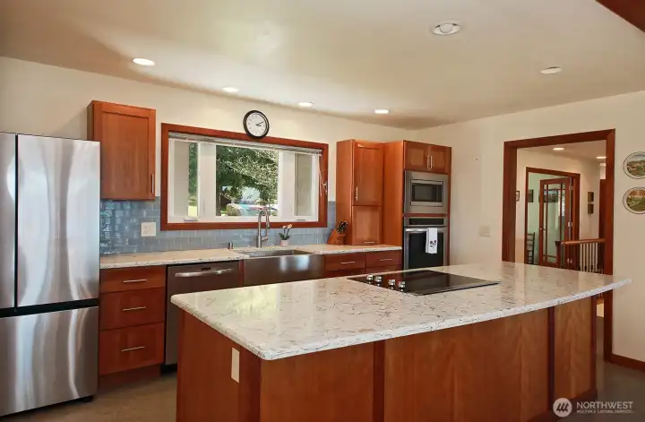 Anderson windows throughout! And, lots of them! You can see the opened glass doors of the office along the right side of this photo. Dining Area is behind you.