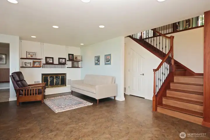And, a whole SECOND level lives at the base of the gorgeous staircase. Fireplace is plumbed for propane. TONS of storage on this level. The workshop is located on the other side of the wall with the fireplace.
