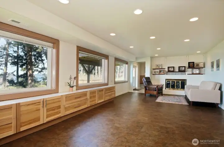 Windows, windows, windows, and, yes another set of French doors at the lower level entry (in the distance beyond the third window). There are two entrances to the workshop, one of them being in the entryway.