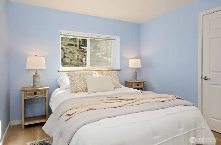 Second of two lower level bedrooms. Closet along the right edge of the photo. There is no view from this room, yet still plenty of light!