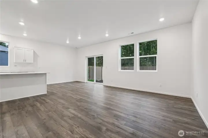 Kitchen island central to it all.   Pictures are for representational purposes only, colors and features may vary.
