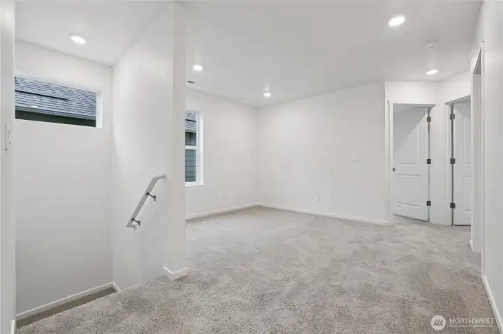 Loft area right off the stairs making the upstairs feel open.   Pictures are for representational purposes only, colors and features may vary.