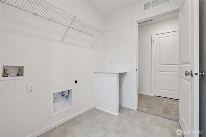 Laundry days just got easier with this space being upstairs.   Pictures are for representational purposes only, colors and features may vary.